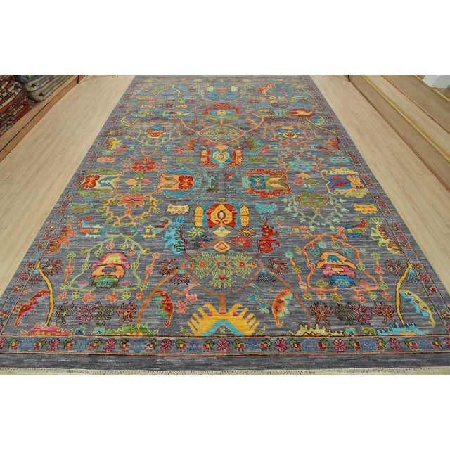 This modern traditional Anatolia rug is hand-knotted with an all-wool pile on a cotton foundation. This rug is new and in...
