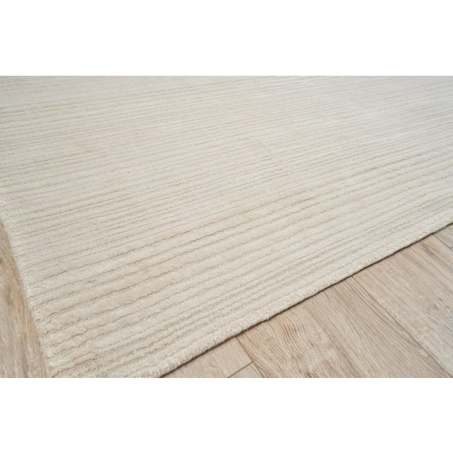 The Rossini rug was designed to ground any room with its lush softness, rich dimensional texture and striated design. Made...