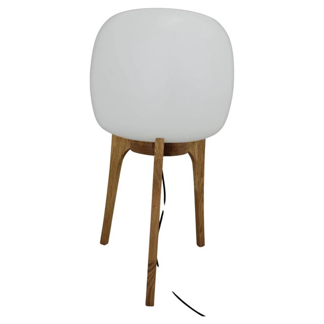 Original glass shade - newly made oak wooden base. This piece is attributed to the mentioned designer/maker. It has no...