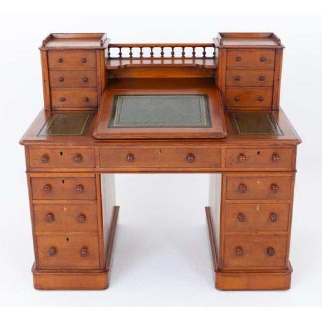 Victorian oak Dickens desk This desk features 2 pedestals and is raised upon a plinth base Circa 1860 Having an...