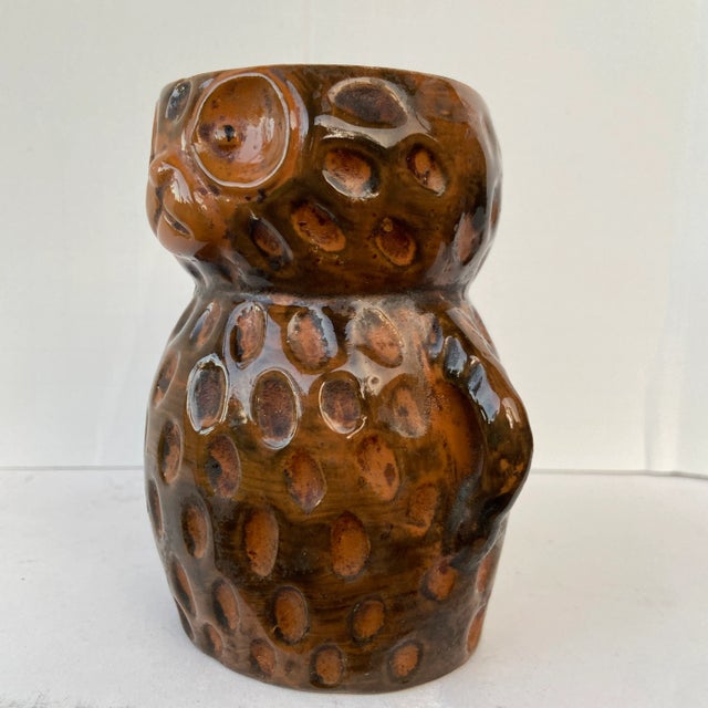 This rustic handmade pottery can be used as a vase or a cup. The thumbprints add texture to this authentic piece.