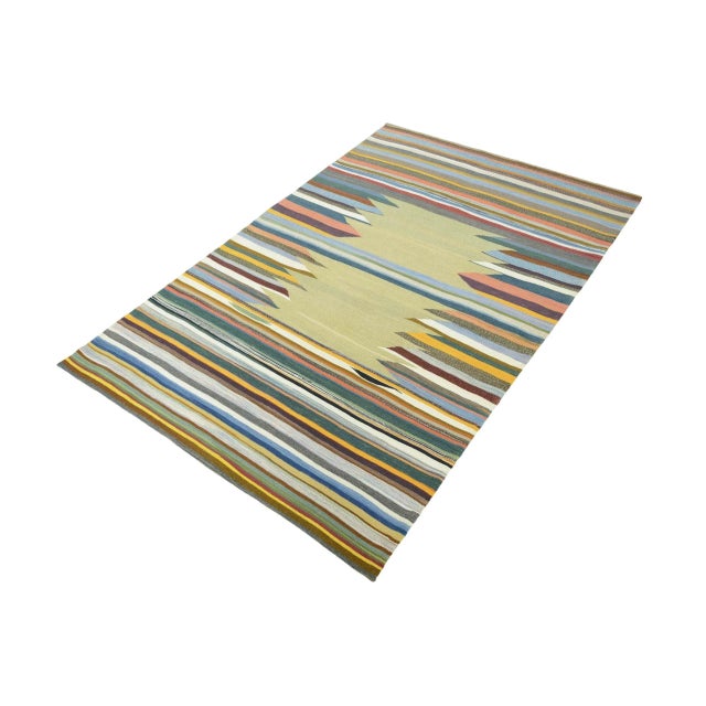 This handwoven designer kilim combines artistic freedom with traditional weaving. The contrasting stripes and jagged...