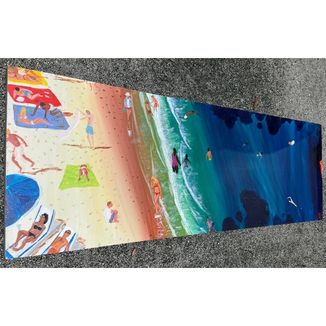This painting by Joe Davis, is an acrylic on canvas artwork showcasing a top-down view of people on a sandy shore and in...