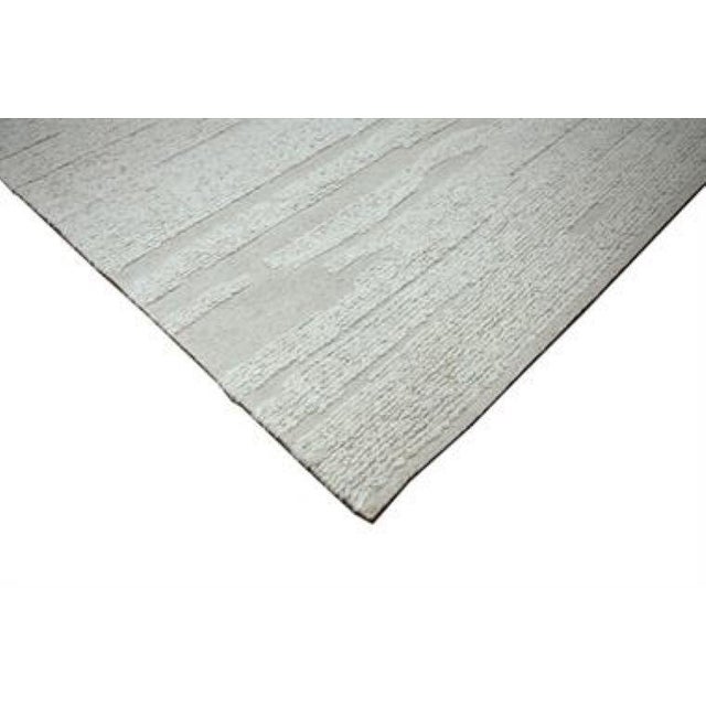 Beautiful hand knotted modern rug. Made of 75% wool and 25% cotton with very modern design and colors, this extremely...