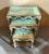Add a touch of elegant French charm with this beautiful set of three nesting tables, featuring a soft aqua green finish...