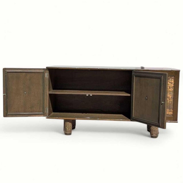 Vintage Rattan and Bamboo Door Sideboard Cabinet. A vintage storage cabinet with a long sideboard profile, warm wood case,...