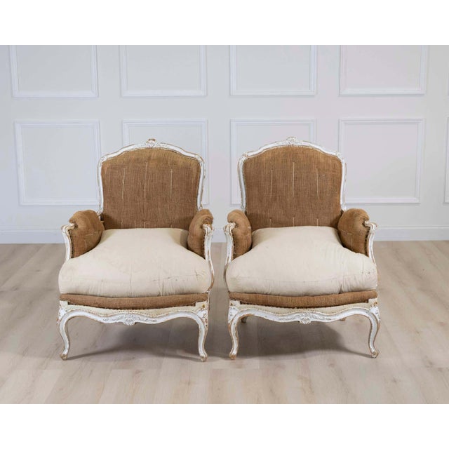 Elegant pair of early 20th century French chairs offering timeless style and exceptional versatility. Stripped and...
