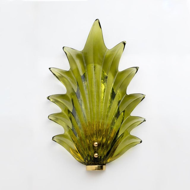Beautiful murano glass leaves in a wonderful green color, made even more beautiful by the polished brass base. The...