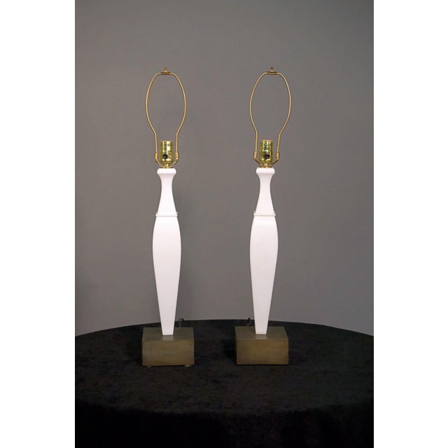 A pair of 20th century Italian white marble and bronze lamps.