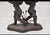 Bronze & Glass Double Cherub Foyer Center Table BEVELED GLASS TOP FOYER TABLE WITH (2) BRONZE CHERUBS ON BASE HOLDING...