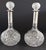 A refined pair of antique cut crystal decanters featuring substantial 880 silver collars and matching cut crystal...