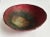 Vintage colorful Raku, artist made metal bowl. An array of matte and metallic reds flow into black then to the gold...