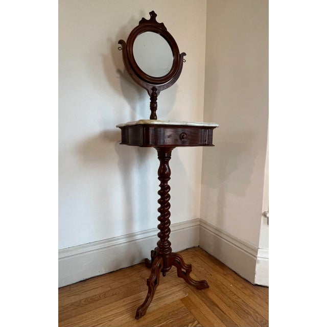 A beautifully detailed antique mid to late 19th Century Victorian Walnut Gentleman’s Shaving Stand with swivel mirror and...
