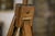 An elegant folding painter's easel with a tripod frame made of wood (probably beech) and steel hardware. The head features...