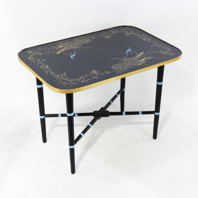 This stunning pair of vintage side tables features a sophisticated black lacquer finish accented by a striking gold-rimmed...