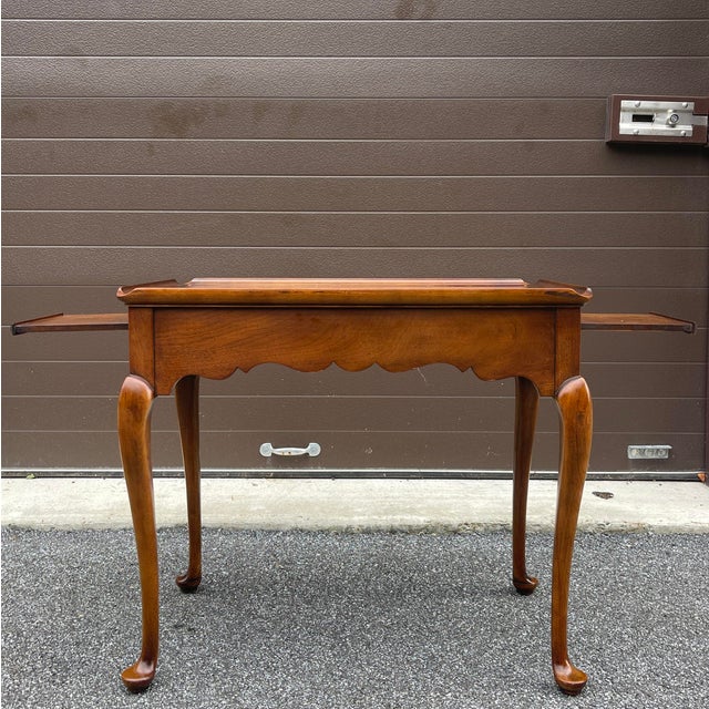 A late 20th century Statton Furniture Traditional Queen Anne style solid cherry tea table in their Oxford finish having a...