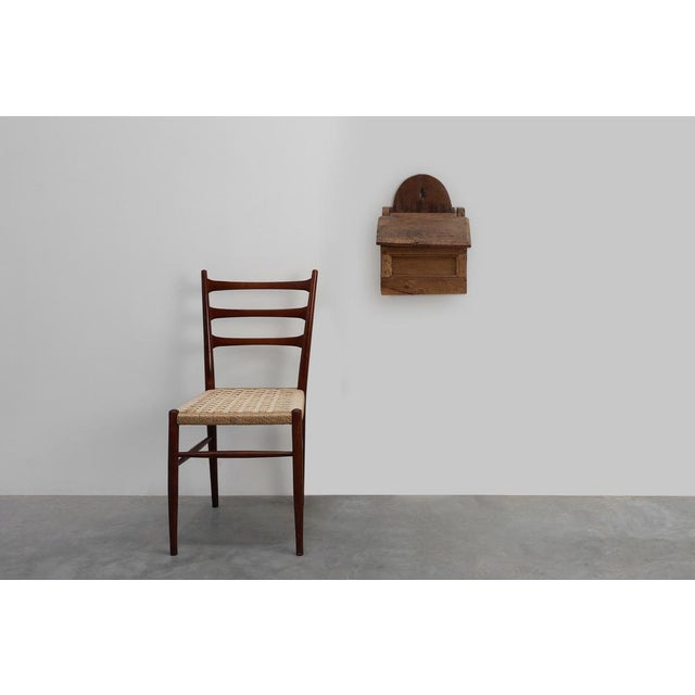A beautifully aged French oak wall‑mounted salt box dating to the mid‑19th century. Handcrafted in solid oak, this rustic...