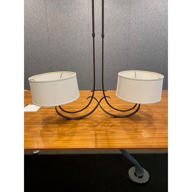 This exceptional ⁠Hubbardton Forge two-light chandelier beautifully highlights the brand's legendary commitment to...