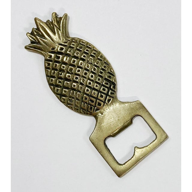 Vintage Hollywood Regency style brass pineapple motif bottle opener. Great detail. Patina.
