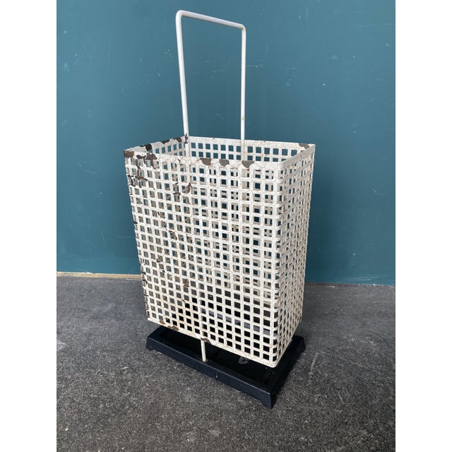 This rectangular umbrella stand with a geometric structure is attributed to Joseph Hoffmann and dates from the time of the...