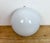 Vintage wall light made in former Czechoslovakia during the 1960s. It featutes an iron wall mounting and a milk glass...
