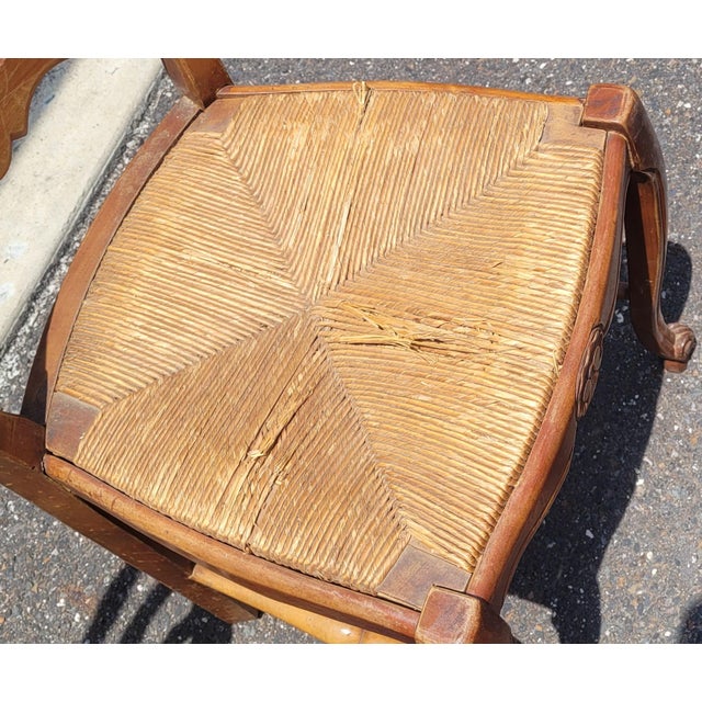 Vintage set of six country French shell carved dining chairs featuring five side chairs and one arm chair. Each chair has...