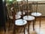 Offered is a matching set of six early 20th-century bentwood dining chairs manufactured by Mazowia of Poland. These...