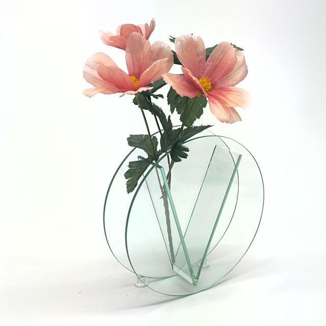 Circular decorative vase. This 1980s striking geometric vase embodies postmodern style. Its unique circular form features...