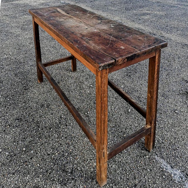 This is a solid oak table, a piece of rustic and vintage country furniture, dating back to the 1900s. Its simple...