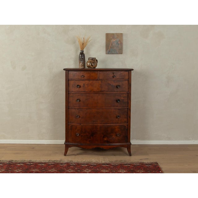 Wonderful chest of drawers from the 1920s. High-quality dark-stained beech body with five drawers and period-typical feet....