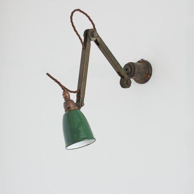Original antique industrial articulating wall lamp by edl an original articulating wall lamp manufactured by edl. A...
