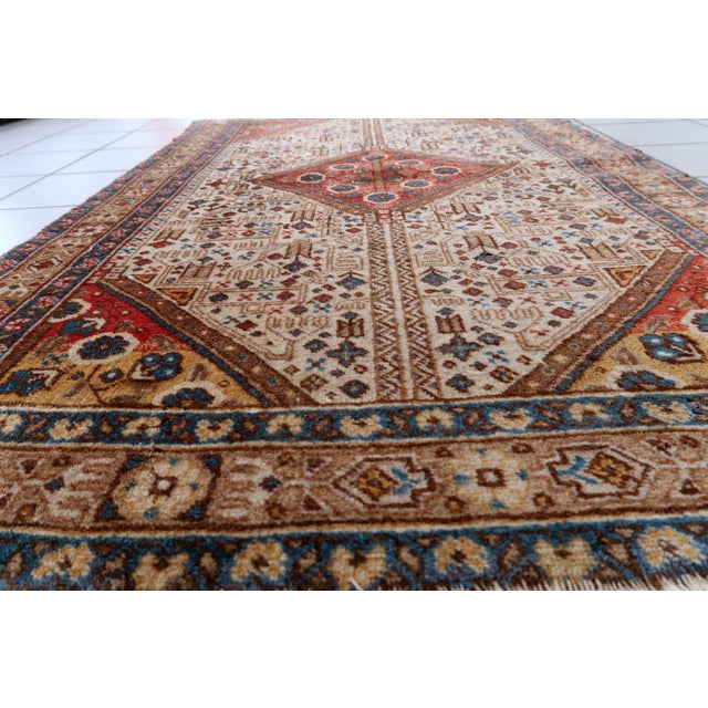 This exquisite vintage Persian Malayer rug, dating to the 1930s, is a beautiful example of the "Village-Art" weaving...