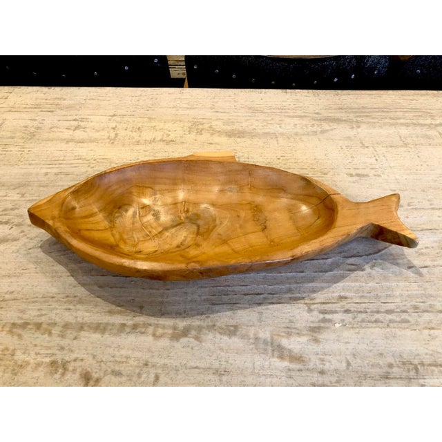 Beautiful hand crafted solid teak wood fish bowl. Each wonderfully unique in exact wood tones, grain, and natural...