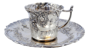 Cup and Saucer in Embossed Silver with Floral Motifs