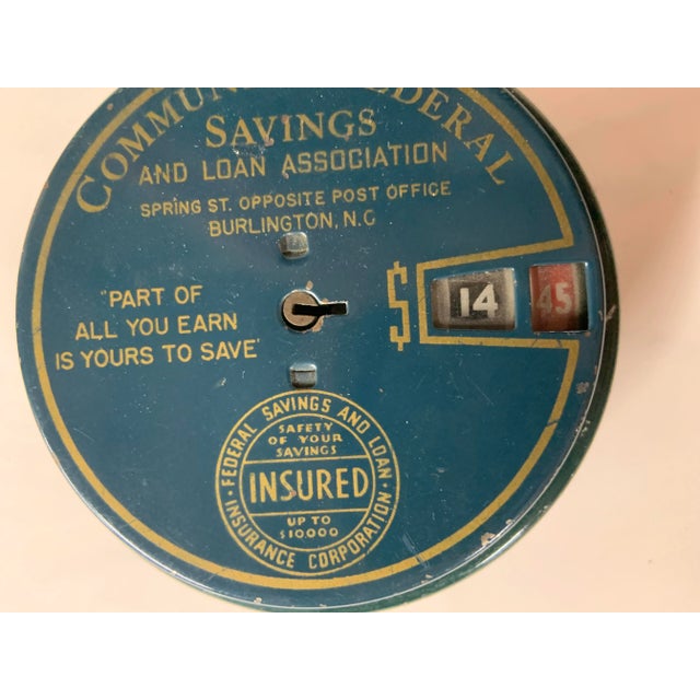 Vintage metal savings bank from Community Federal Company. No key.