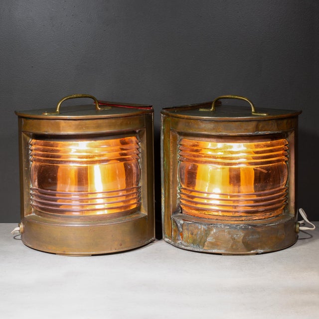 ABOUT A pair of beautifully patinated, molded copper antique nautical ship lanterns, specifically designed as navigation...
