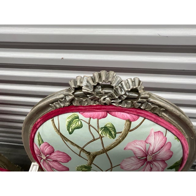 Stunning pair of Louis XVI antique fauteuils newly reupholstered in Manuel Canovas gorgeous floral fabric. Arm chairs are...