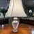A classic Waterford crystal table lamp featuring a substantial urn-form base covered in deep diamond cutting. The clear...