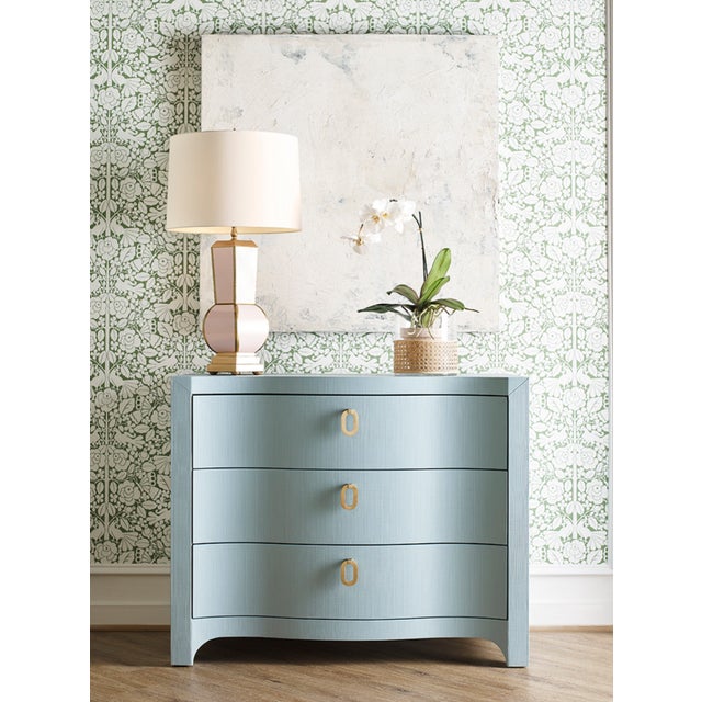 Embrace coastal chic elegance with the Cora LB chest! This exquisite curved-front chest features three drawers equipped...