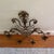 A dramatic statement piece in the Hollywood Regency tradition. This ornate Italian wall sconce features sweeping...