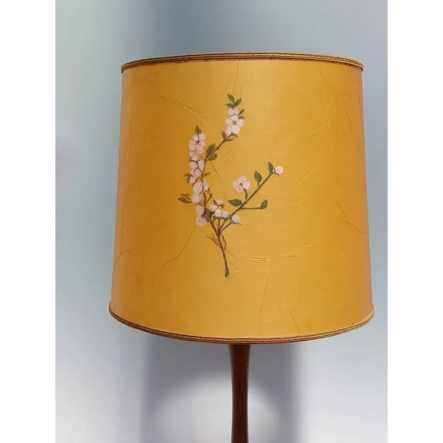 Elevate your space with a true work of art that combines the beauty of a lacquered wooden lamp base with a hand-painted...