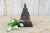 Standing on a custom wood stand, this exquisite Burmese buddha statue is carved from wood with a thin hammered metal alloy...