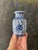 Two pretty Asian pieces, each, in a crisp white ceramic, with a glossy glaze over a rich, royal blue pattern. These are...