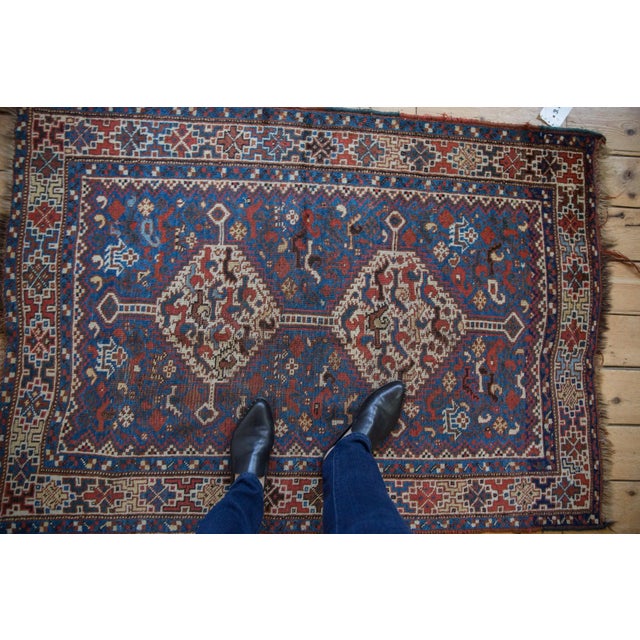 :: Double interconnected medallion with outwardly directed long stemmed finials atop a covered field of birds and animals....