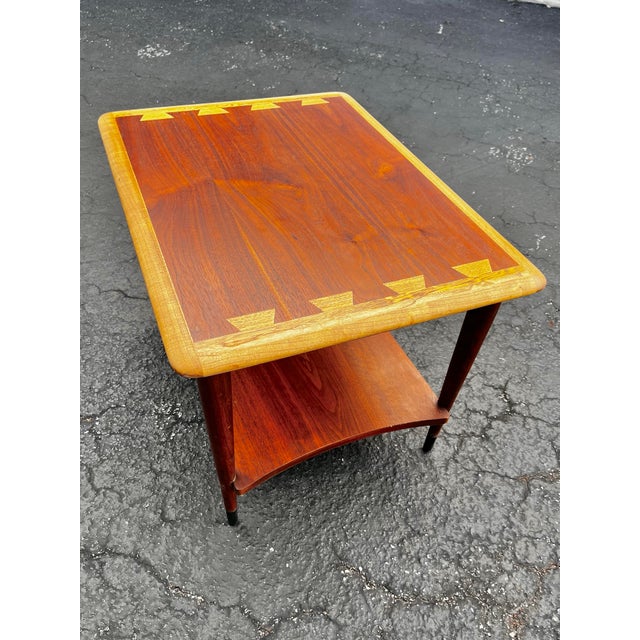 Mid-century modern ‘Acclaim’ rectangular side table with curved lower shelf. By AltaVista Lane Furniture. Classic dovetail...