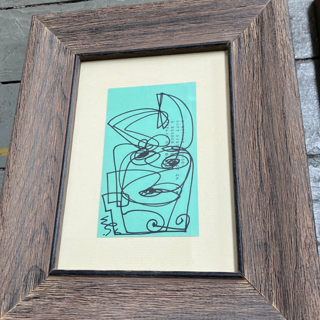 2 original 3 x 5 ink drawings done on vintage turquoise index cards both signed laid down on cream colored mat board...