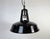 This industrial lamp was made by mazda in france during the 1960s. It features a black enamel shade with white enamel...