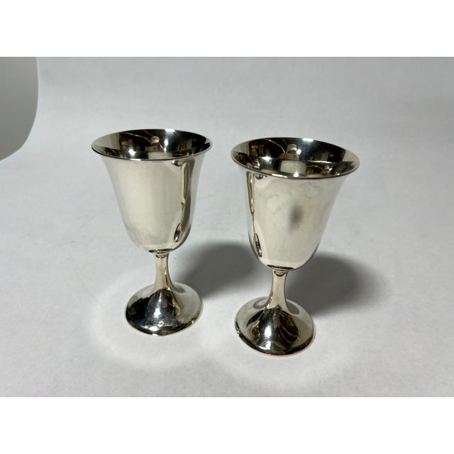 A refined set of mid-century modern sterling silver goblets, crafted with clean lines and elegant proportions that embody...