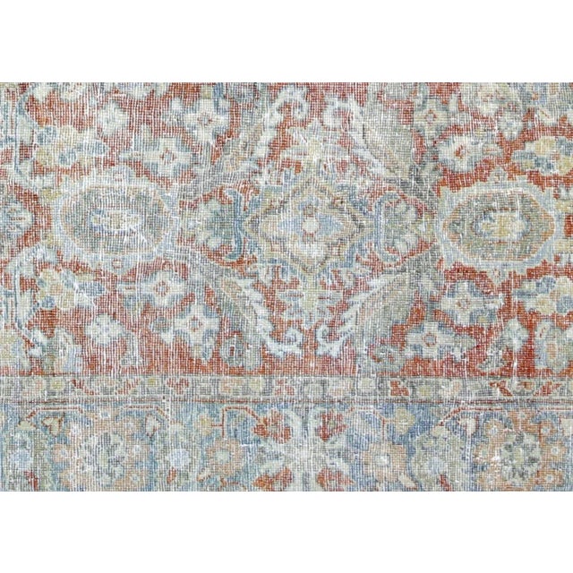 1960s Persian Mahal Rug. Hand woven in the Mahal region of Iran. Distressed and refinished in the U.S. The Persian carpet...