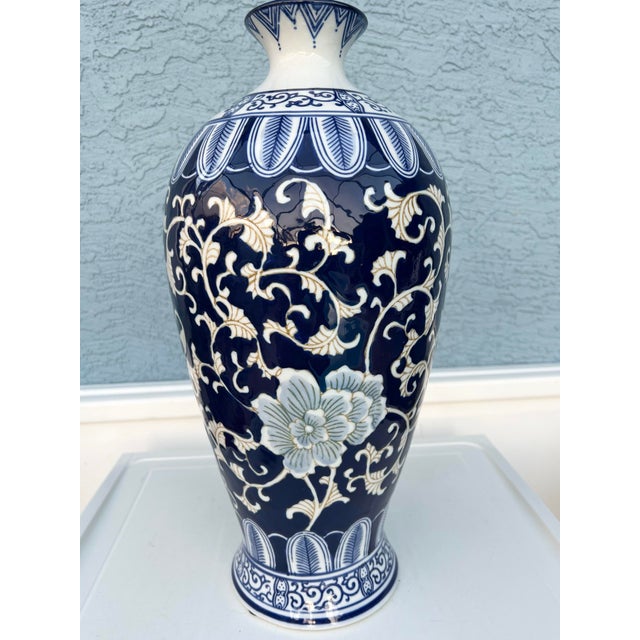 Large Floor Vase Cobalt Blue And White Hand Painted Floral & Scroll design. Approximate measurements: 17" tall. and 8" at...